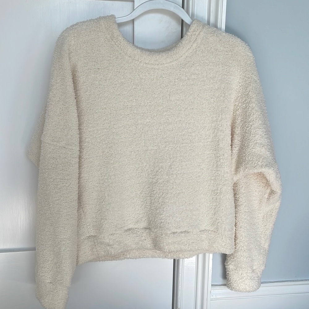 White fluffy sweater.